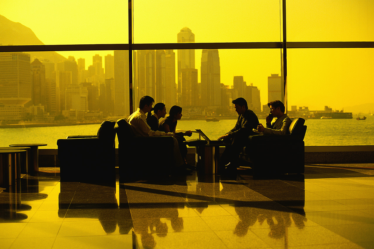 Visible through the lobby window at the Hong Kong Convention and Exhibition Centre are skyscrapers of Hong Kong, and Victoria Harbour. ca. 1980-2000 Hong Kong, China